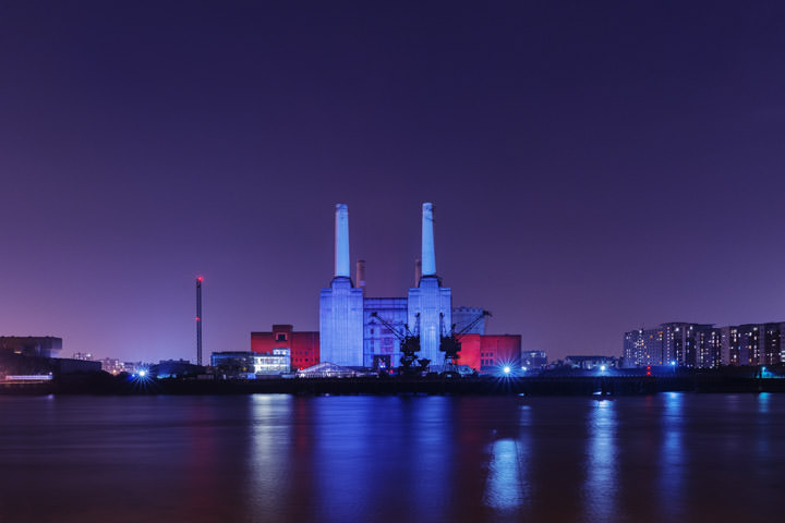 Battersea Power Station floodlit in blue and purple at Night