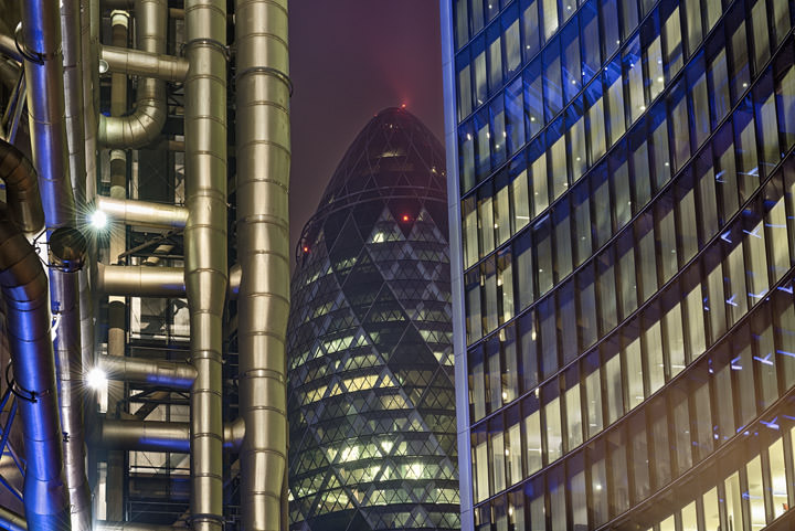 City of London Buildings illuminated at night.