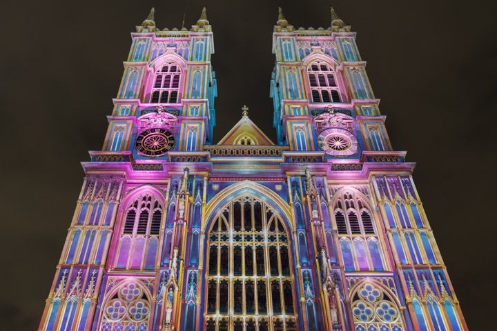 Westminster Abbey illuminated in pink and blue for a seasonal light show
