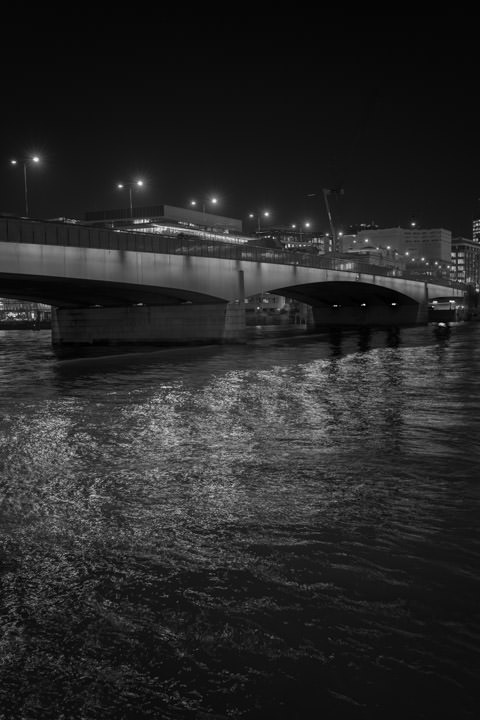 Black and White photo of London Bridge at night.