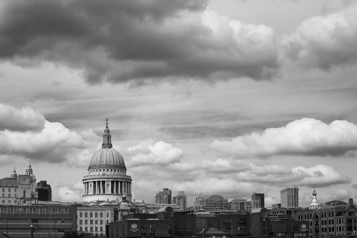 Puffy clouds St Pauls Cathedral in black and white