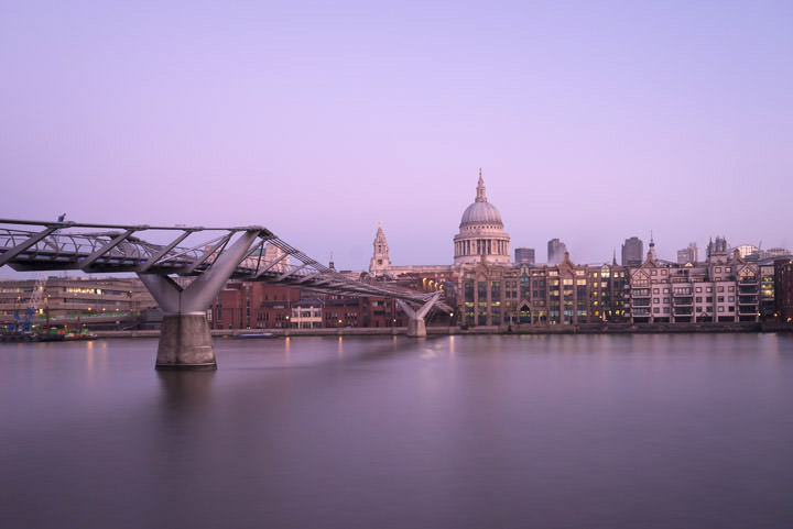 Pink dawn St Pauls Cathedral and the Millennium Bridge from west